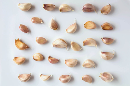 clove garlic isolated on white backgroundの写真素材