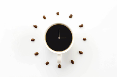 Coffee cup on saucer and coffee beans against white background forming clock dial. offee as symbol...