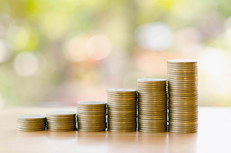 save money with stack money coin for growing graph your businessの写真素材