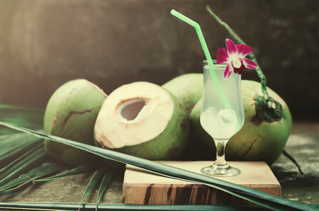 coconut juice and drinking sweet coconut water in glassの写真素材