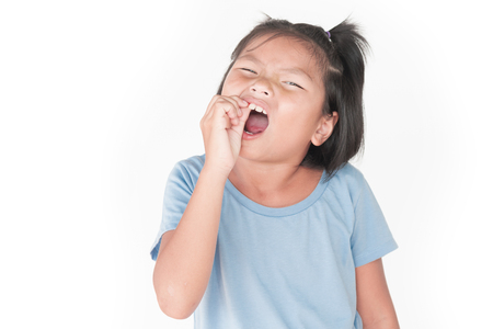 Little girl has sick is  toothache isolate on white backgroundの写真素材