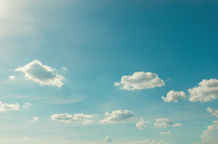 clouds with sunshine and blue sky background