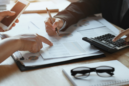 teamwork business woman checking finance report in office. accounting conceptの写真素材