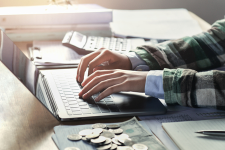 Businesswoman working on desk with using laptop. Finance and accounting conceptの写真素材