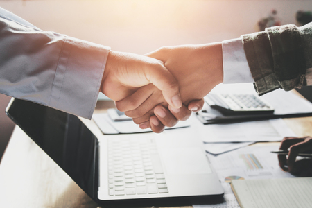 Businessmen handshake after  meeting in the officeの写真素材