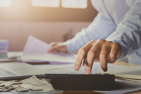 An accountant using calculator to calculate of finance and accountingの写真素材