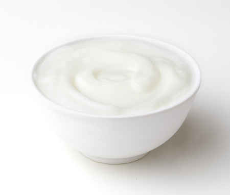 bowl of yogurt isolate on white backgroundの写真素材