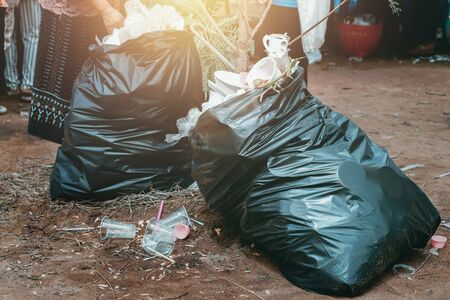 garbage in  plastic black in parkの写真素材
