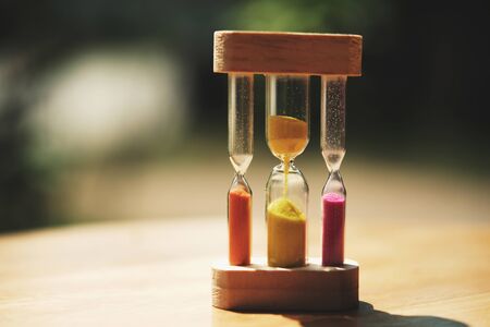 hourglass on table  and sunset