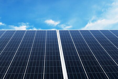 Solar panel with blue sky and sunshine. concept clean energy, electric alternative, power in nature