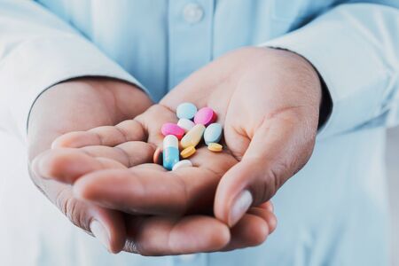 doctor holding medicine on hand. concept health care and medical