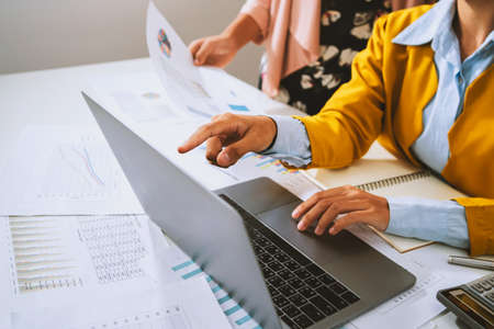 accountant  pointing on laptop for meeting team in office room. concept finance and accountingの写真素材