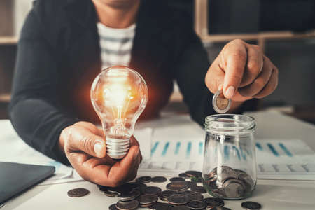 hand holding light bulb. idea concept with innovation and inspirationの写真素材