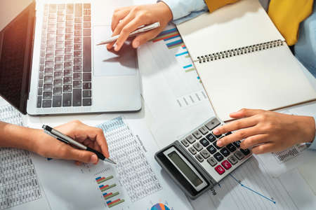 accountant  pointing on laptop for meeting team in office room. concept finance and accountingの写真素材