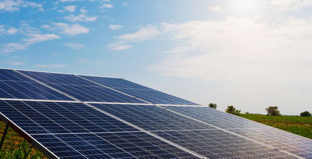 solar cell panel with blue sky and sunset. energy cleaning in nature conceptの写真素材