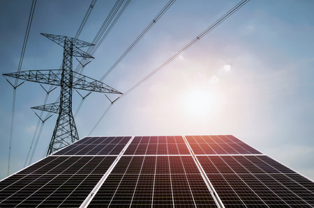 electricity power in nature. clean energy concept. solar panel with turbine and tower hight voltageの写真素材
