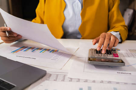 accountant  pointing on laptop for meeting team in office room. concept finance and accountingの写真素材