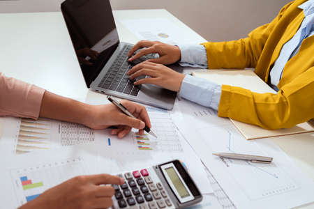 accountant  pointing on laptop for meeting team in office room. concept finance and accountingの写真素材