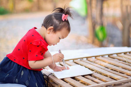 children girl learning at outdoor