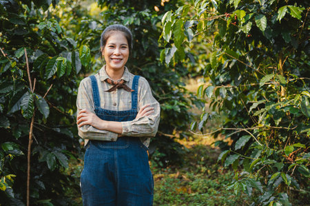 young woman standing with smiling at coffee farmの写真素材