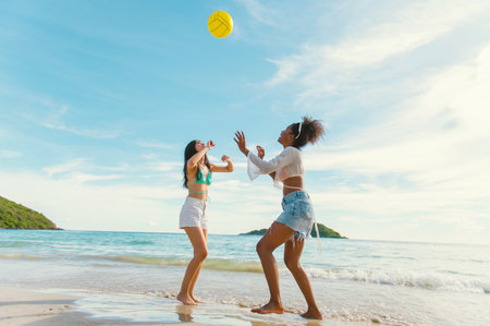 beautiful woman playing ball on the beachの写真素材