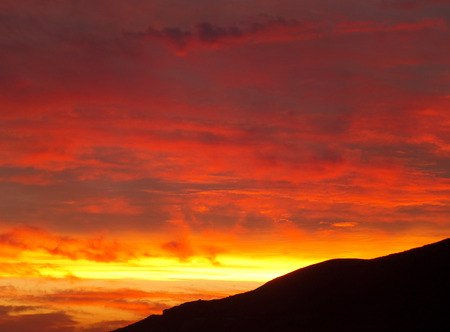 Breathtaking Sunset Afterglow in the Gradation of Orange and Gold at Santorini Island, Greeceの写真素材