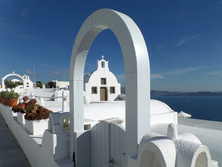 Pure White Architectures against the Blue Sky on Santorini Island of Greeceの写真素材