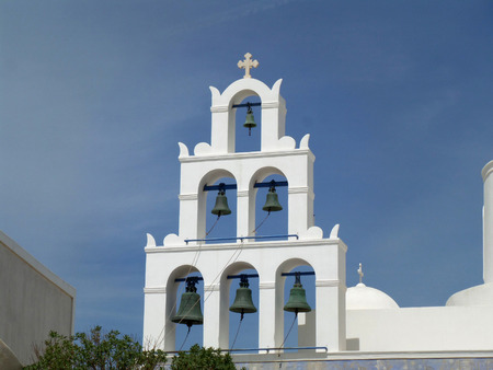 White Bell Tower of a Church and Blue Sky, Santorini Island, Greeceの写真素材