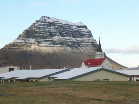 Snow Capped Kirkjufell Mountain seen from the Town of Grundarfjordur, Icelandの写真素材