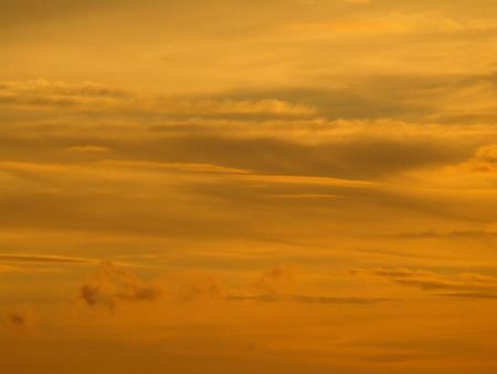 Beautiful golden after sunset cloudy sky, backgroundの写真素材
