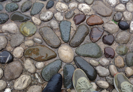 Walking on the Flower Pattern Cobblestone Path in the Rainy day, Mostar, Bosnia and Herzegovinaの写真素材