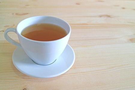 Closed up a Cup of Hot tea on the Wooden Tableの写真素材