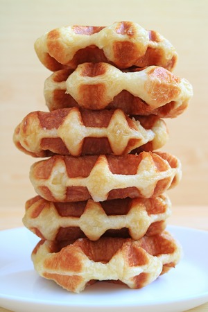 Stack of Fresh Baked Belgian Waffles Served on White Plate, Vertical Photoの写真素材