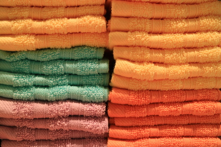Stack of folded vibrant color bath towels, Texture, Backgroundの写真素材