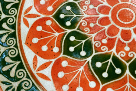 Vibrant orange and deep green color of a painted stone table top, for background and texture