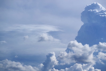 Fluffy Cloud Floating on Bright Blue Sky