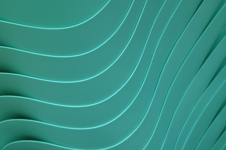 Beautiful curve lines of piled up teal color plastic bowls, for pattern and backgroundの写真素材
