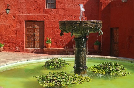 Gorgeous old stone fountain in the courtyard of Santa Catalina Monastery, Arequipa, Peruの写真素材