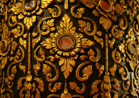 Gorgeous Gold and Black Vintage Thai Pattern on the Teak Lacquered Pillar in Wat Phumin Temple, Nan Province, Thailand, Historic Architectureのeditorial素材