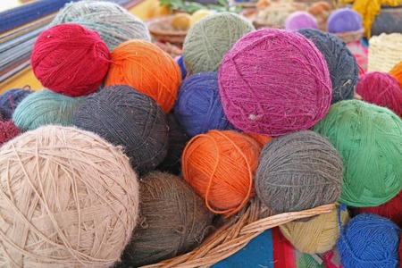 Heap of Natural Dyed Colorful Traditional Peruvian Alpaca Wool Yarn Balls at Chinchero, Andes Textile Village Cuzco Region of Peruの写真素材