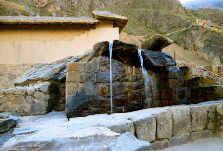 The Fountains of the Water Temple Still in the Original State of the Inca Empire, Ollantaytambo Fortress Ruins, Cusco, Peruの写真素材