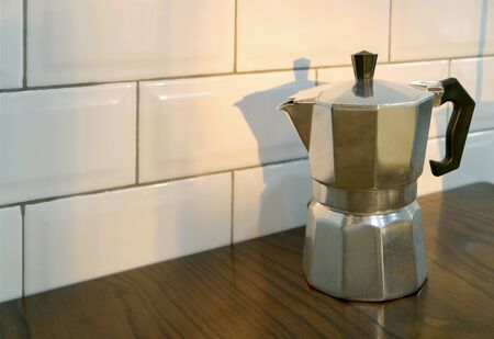 Moka Coffee Pot on Kitchen's Wooden Table with Copy Space