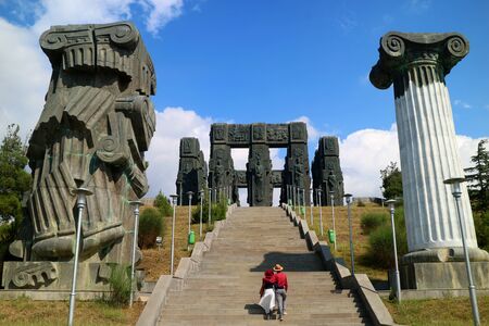 Couple on the Staircase of the Chronicle of Georgia, a Jaw dropping Monument Located on the Hilltop near Tbilisi City, Georgia Countryの写真素材