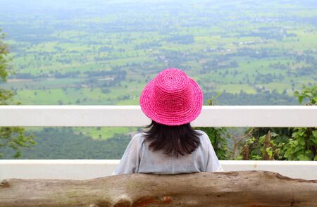 Woman in Vivid Pink Straw Hat Enjoy the Aerial View of the Lush Valley