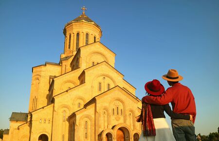 Couple Being Impressed by the Holy Trinity Cathedral of Tbilisi or the Sameba, Located in Tbilisi of...