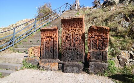 Group of Old Khachkar (Armenian Cross-stones) beside the stairs up to Sevanavank Monastery, Sevan Peninsula in Armeniaの写真素材