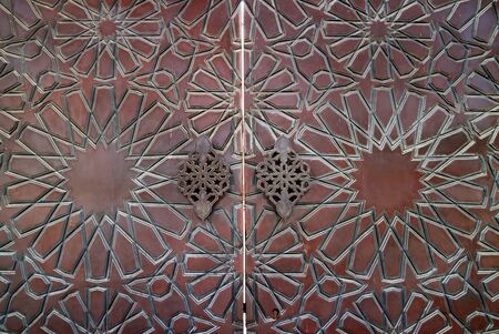 Gorgeous Arabian Pattern of the Mosque Wooden Door in Manama, Bahrainの写真素材