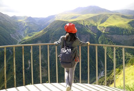 Female Traveler Admiring the View of Devil's Valley from Russia-Georgia Friendship Monument in...