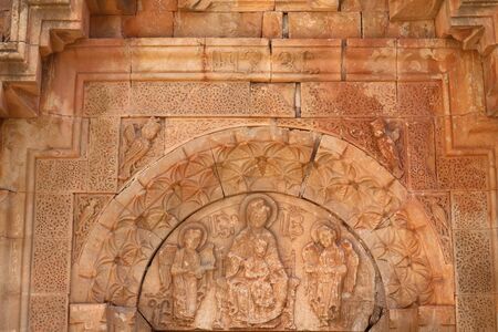 Impressive Medieval Tympanum of the First Floor Entrance at the West Facade of Surb Astvatsatsin Churchの写真素材