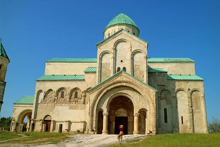 The Bagrati Cathedral or Cathedral of the Dormition with a Female Visitor at the Entrance, Kutaisi,...
